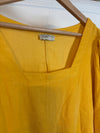 Gele blouse