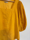 Gele blouse