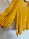 Gele blouse